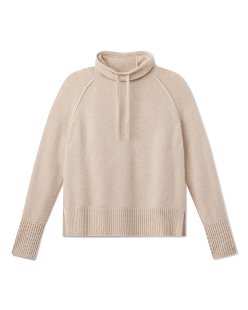 Cashmere drawstring funnel neck sweater in oatmeal color, long sleeves, ribbed cuffs and hem, flat lay on white background