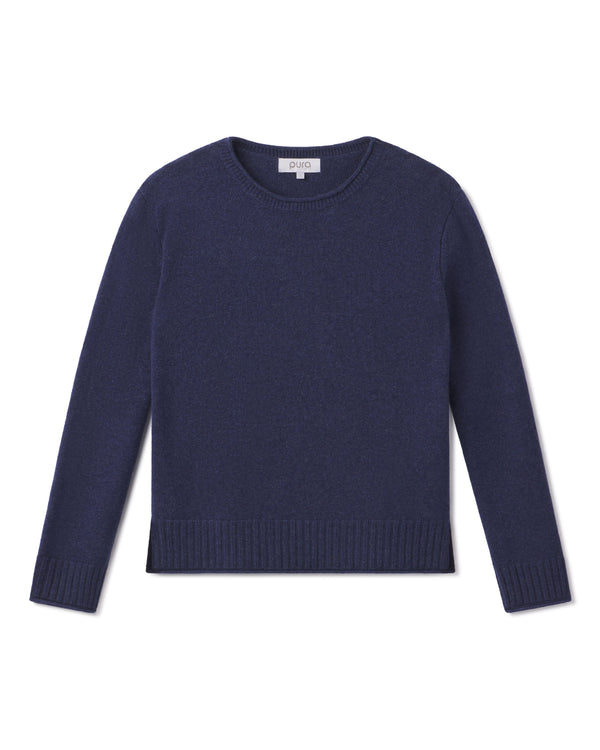 Cashmere crewneck sweater in indigo blue, long sleeves, ribbed cuffs and hem, flat lay on white background