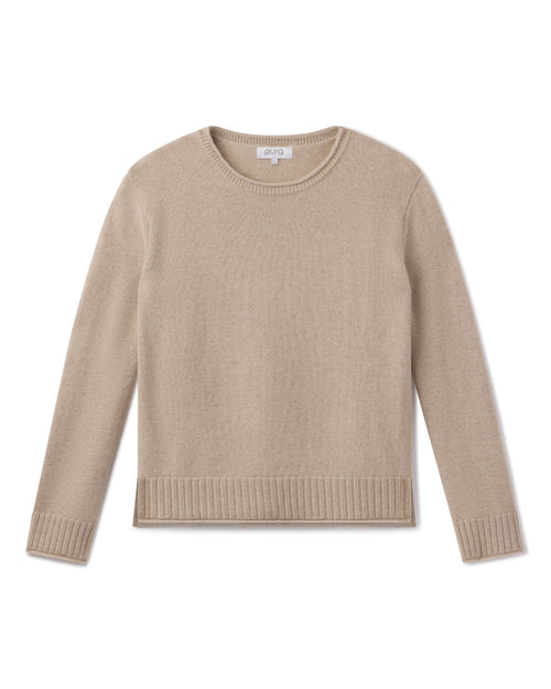 Beige cashmere crewneck sweater with ribbed cuffs and hem, laid flat on white background