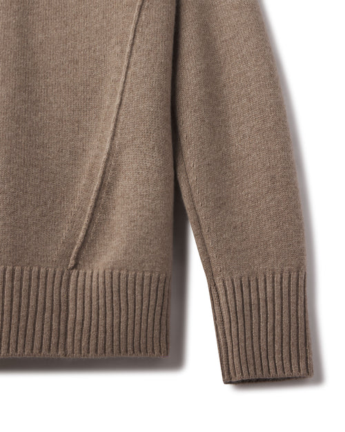 Close-up of the driftwood cashmere funnel neck sweater sleeve and ribbed hem