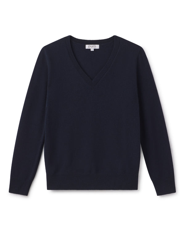 Navy blue V-neck cashmere sweater with long sleeves, laid flat on white background