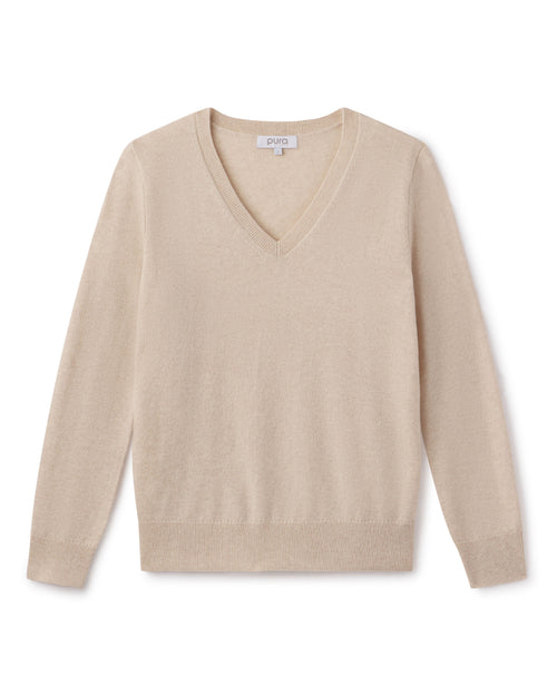 Beige oatmeal V-neck long-sleeve cashmere sweater laid flat on white background