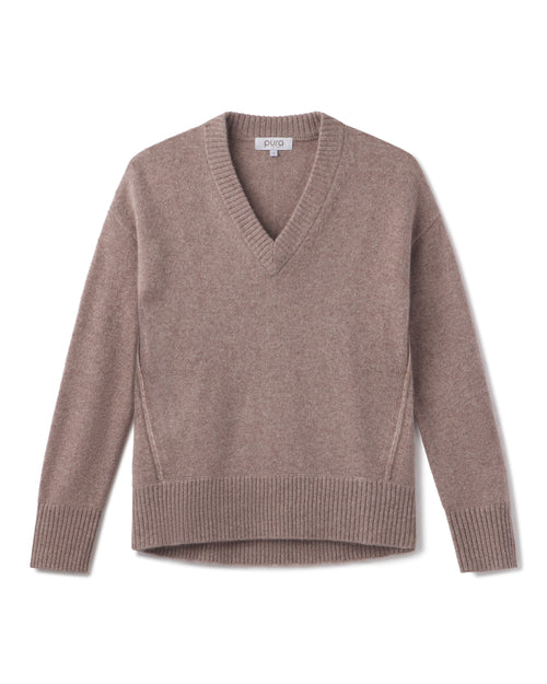 Cashmere V-neck sweater in latte color, long sleeves, ribbed cuffs and hem, flat lay on white background