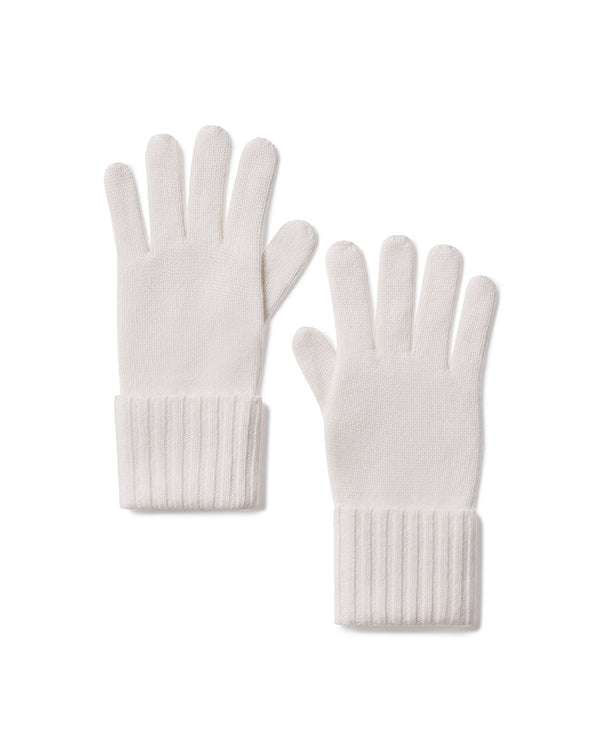 Pair of ivory cashmere gloves with ribbed cuffs laid flat on white background