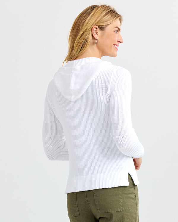 LIFESTYLE / EDITORIAL: Woman wearing white ribbed cashmere hoodie and olive pants, shown from back and side profile