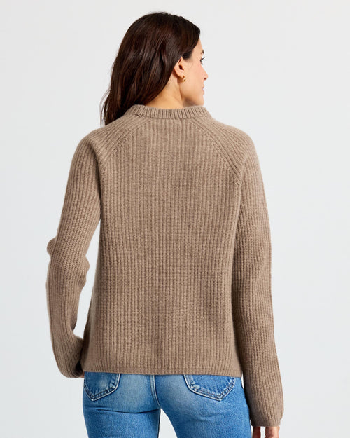 LIFESTYLE / EDITORIAL: Woman wearing a ribbed driftwood-colored cashmere sweater, shown from the back