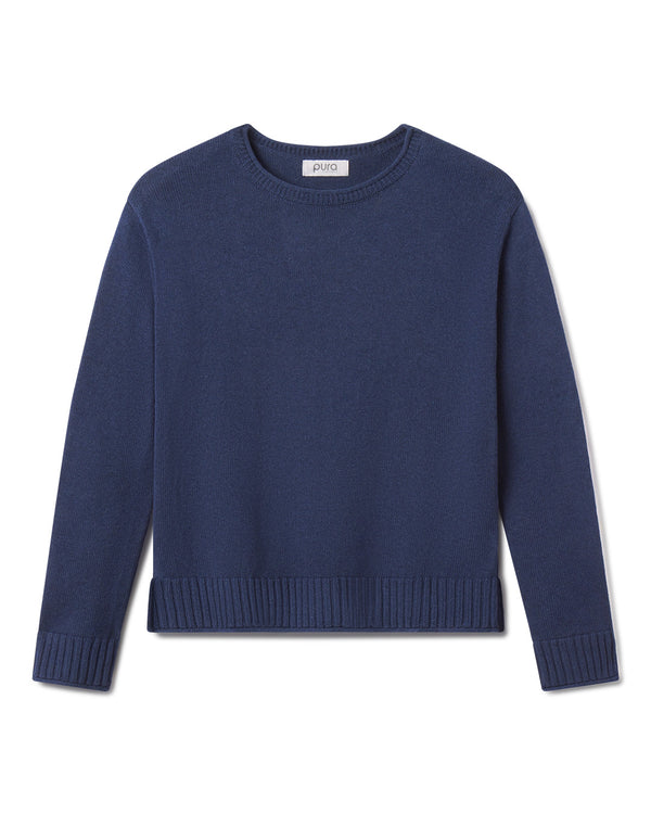 Cashmere crewneck sweater in midnight blue with ribbed cuffs and hem, laid flat on white background