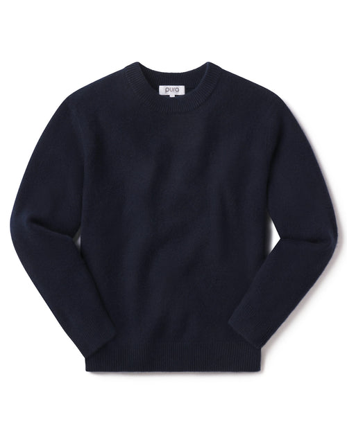 Men's navy blue crewneck cashmere sweater laid flat on white background