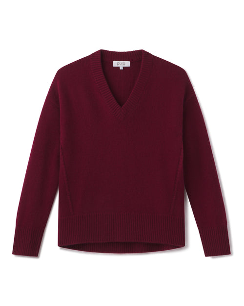 Cashmere V-neck sweater in cabernet red, long sleeves, ribbed cuffs and hem, flat lay on white background