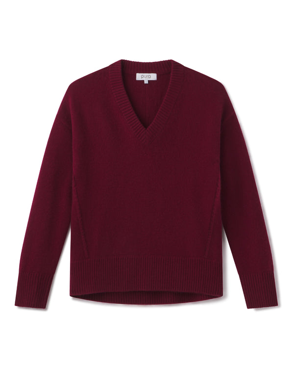 Cashmere V-neck sweater in cabernet red, long sleeves, ribbed cuffs and hem, flat lay on white background