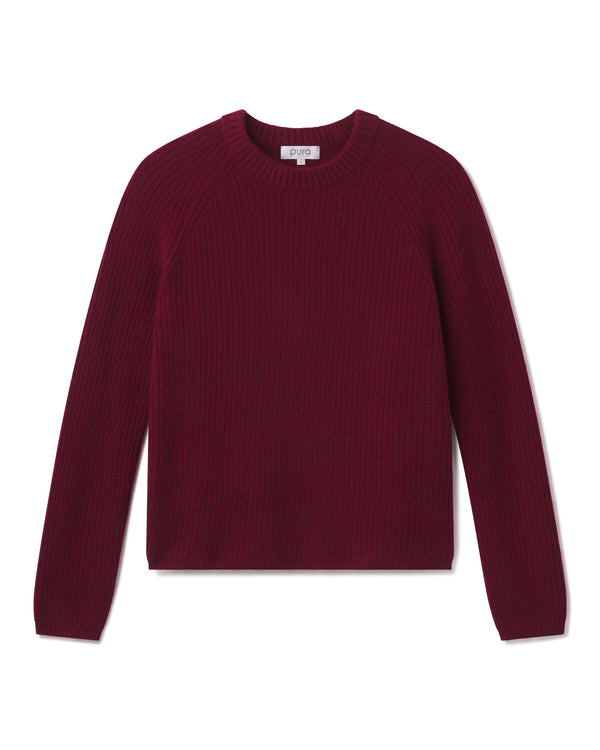 Maroon long-sleeve crewneck cashmere sweater laid flat on white background