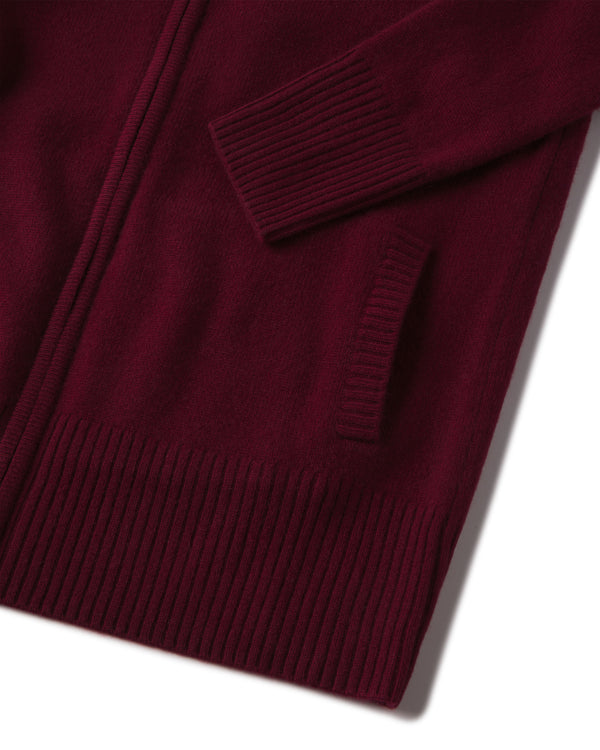 Close-up of barolo-colored cashmere cardigan sleeve, pocket, and ribbed hem detail