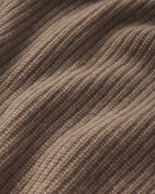 Close-up of ribbed cashmere fabric texture in driftwood brown color