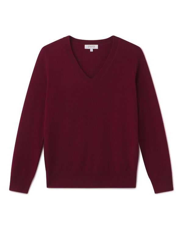 Cashmere V-neck sweater in barolo color, long sleeves, laid flat on white background