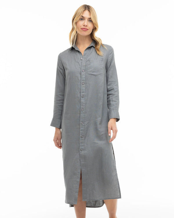 LIFESTYLE / EDITORIAL: Woman wearing long gray button-up shirt dress standing against white background