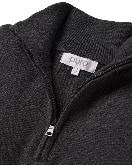 Close-up of dark gray cashmere quarter-zip sweater with visible zipper and Pura Cashmere label size M