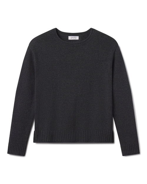 Cashmere crew neck sweater in charcoal gray, long sleeves, ribbed cuffs and hem, laid flat on white background