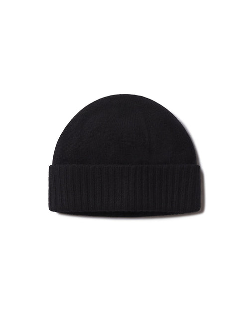 Black cashmere knit beanie hat with folded ribbed cuff, isolated on white background
