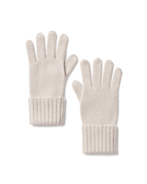 Pair of oatmeal-colored cashmere gloves with ribbed cuffs, laid flat on white background