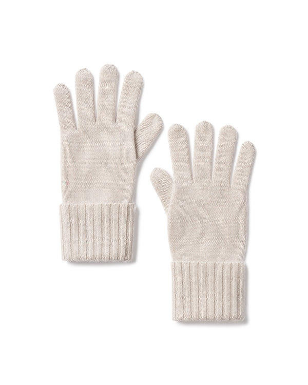 Pair of oatmeal-colored cashmere gloves with ribbed cuffs, laid flat on white background