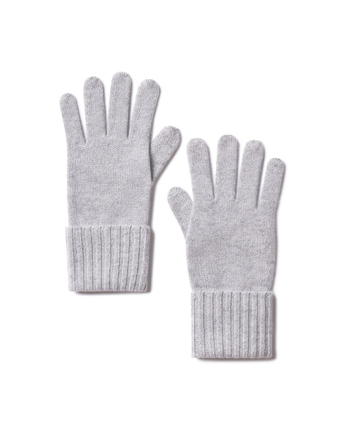 Pair of harbor grey cashmere gloves with ribbed cuffs laid flat on white background