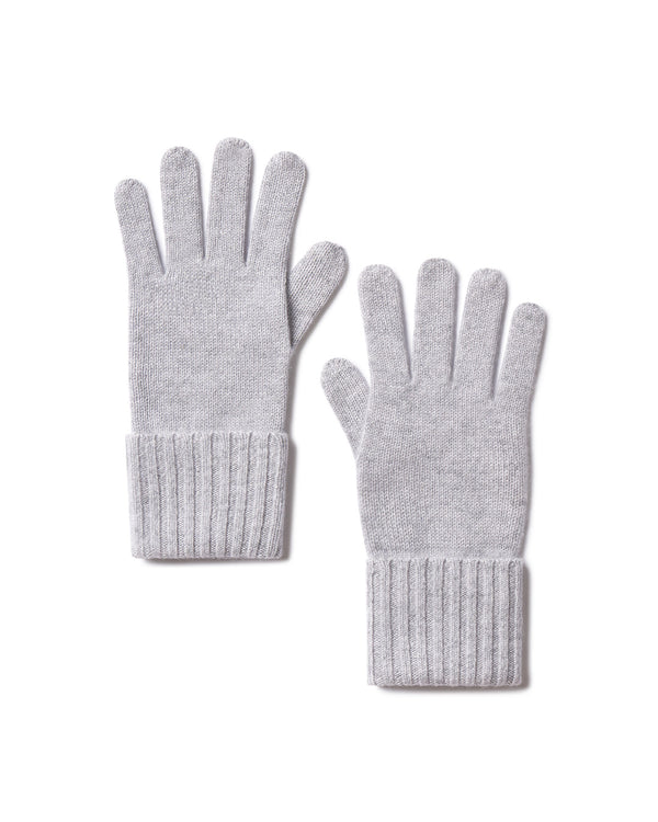 Pair of harbor grey cashmere gloves with ribbed cuffs laid flat on white background