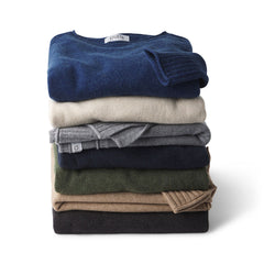 Stack of folded cashmere crewneck sweaters in various colors on white background, Everyday Crew 2 collection